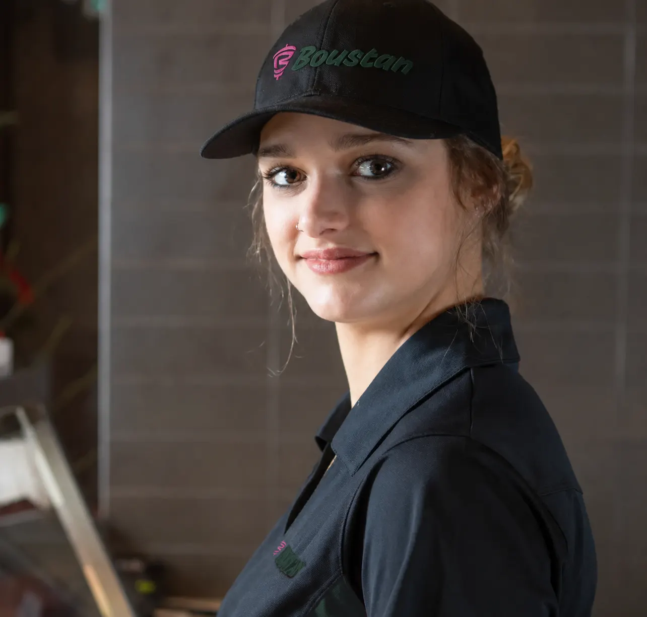 Young woman wearing Boustan uniform