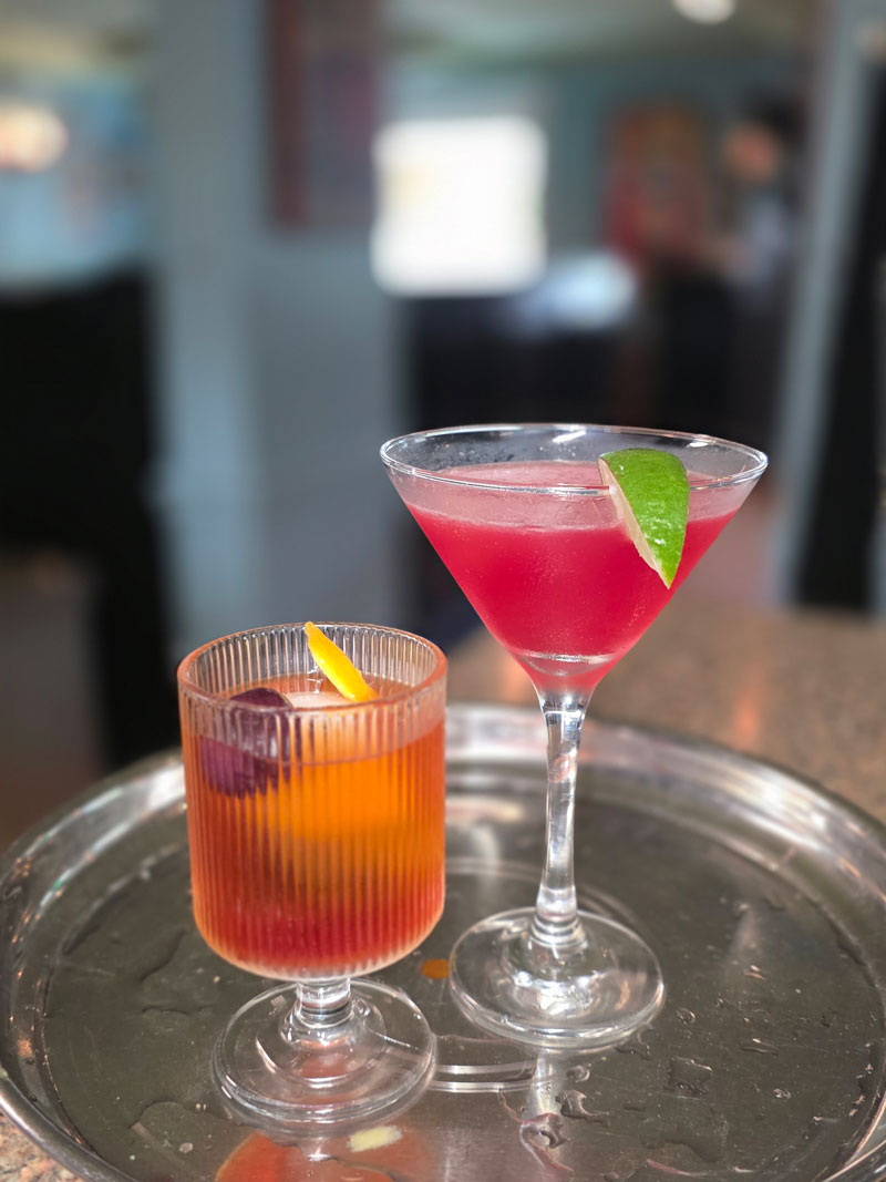 Close-up of a deep red cocktail on a marble bar