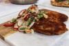 Crispy pork schnitzel with lime-chili slaw