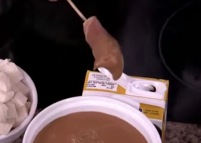 Chicken, cheese and prosciutto skewers dipped in a spicy chocolate molé