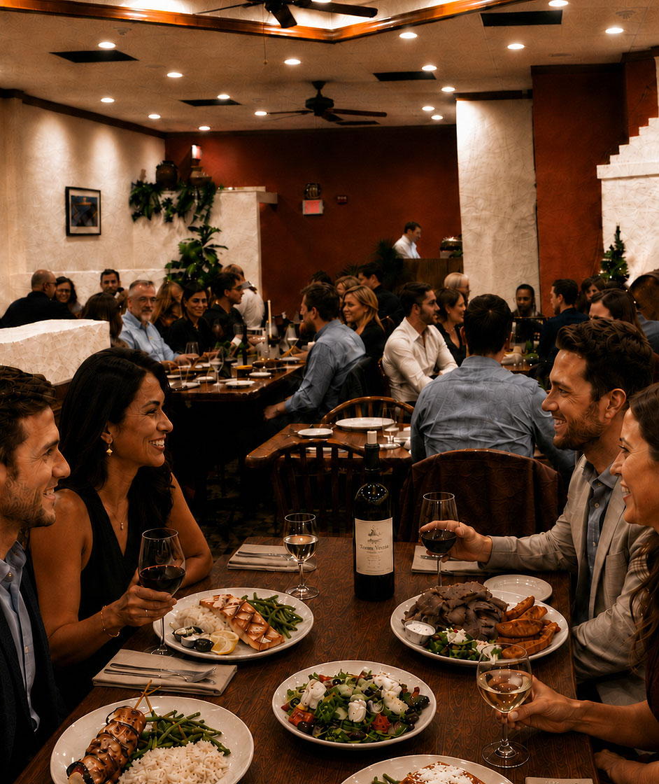 Group of family and friends enjoying dinner as a large group