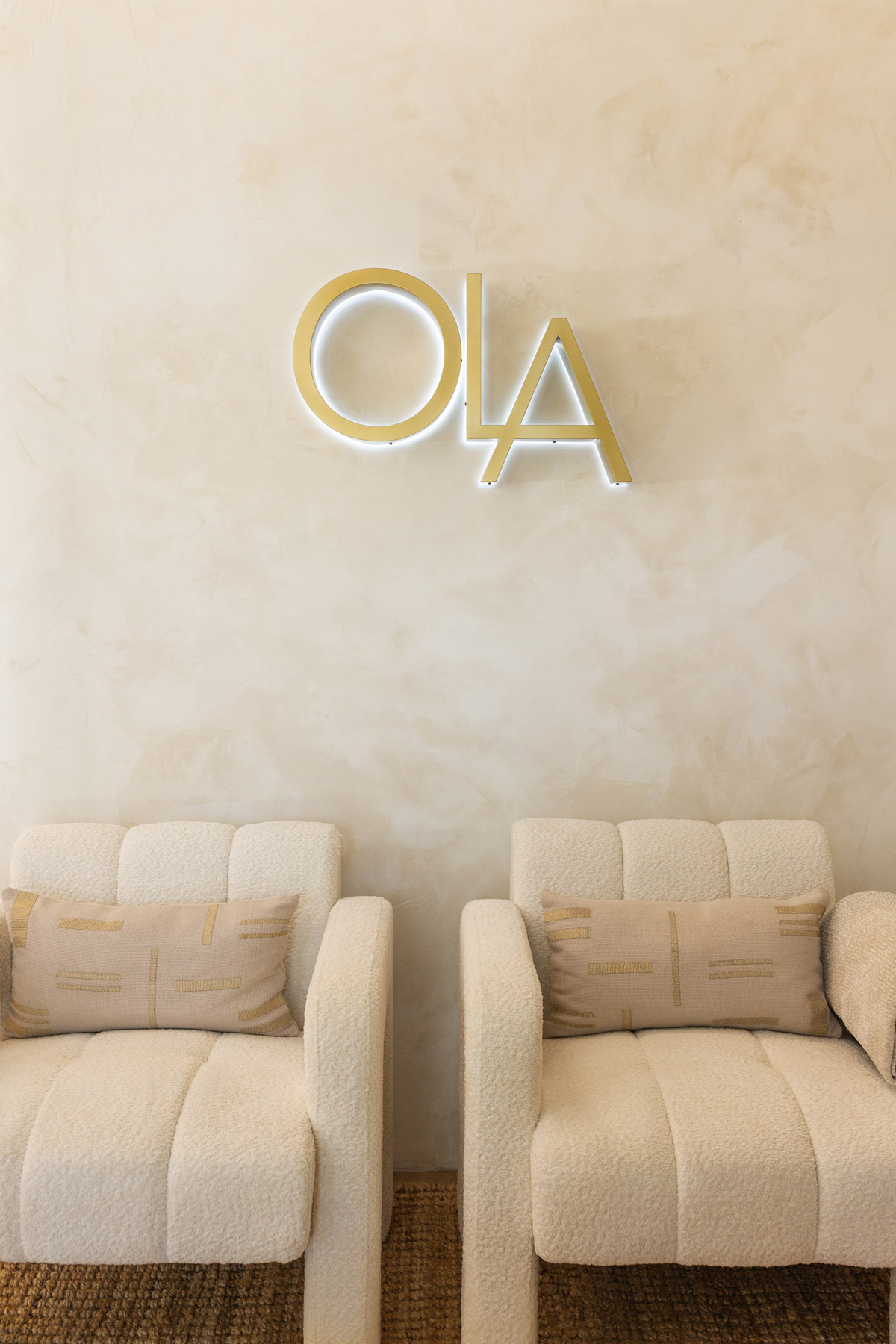 close up of two couches and ola logo