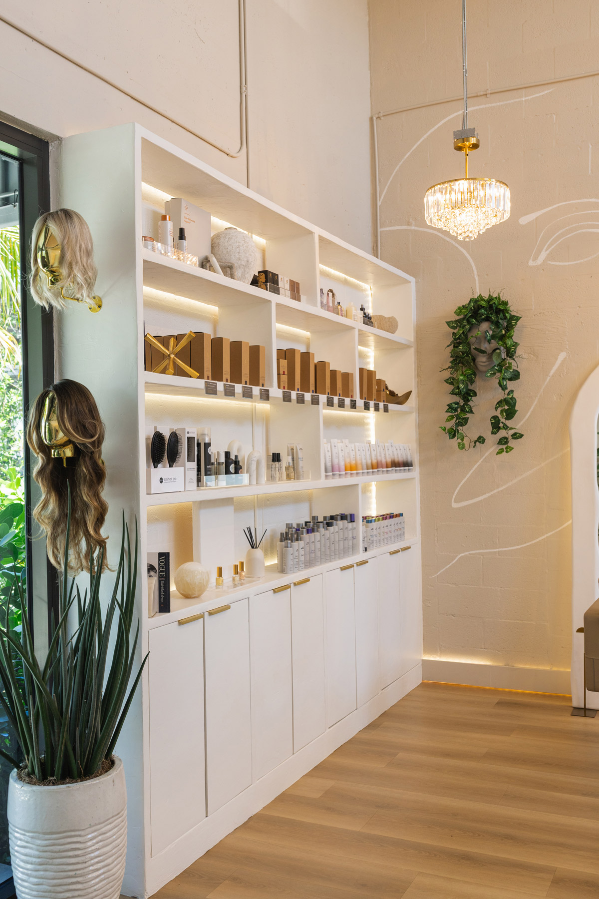 Near salon entrance with view of extensions and products